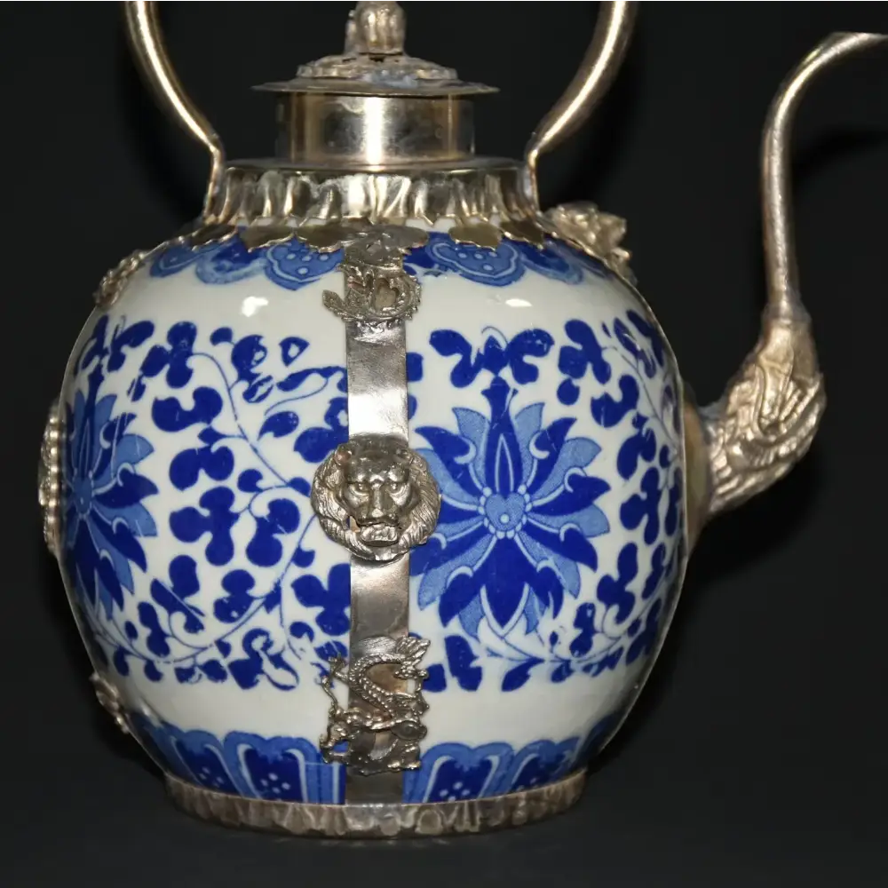 Blue and white porcelain teapot with lid open