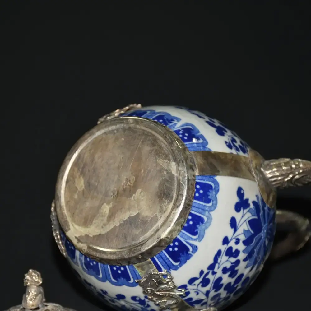 Elegant blue teapot on serving tray with tea set