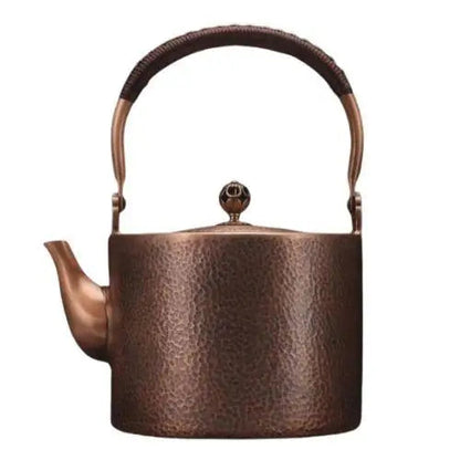 Copper kettle ornate handle detail showing hand-hammered craftsmanship