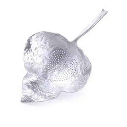 Antique tea strainer in tin with leaf shape
