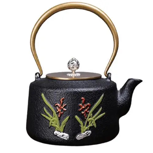 Artisan cast iron teapot with hand-painted golden flowers