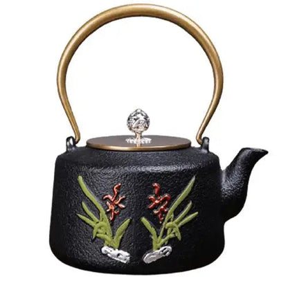 Artisan cast iron teapot with hand-painted golden flowers