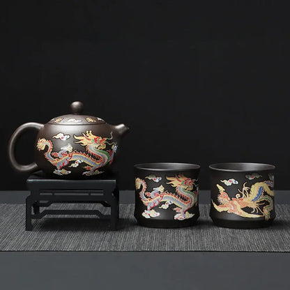 Purple clay teapot with intricate dragon and phoenix motifs