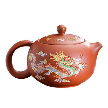 Red ceramic teapot with color-changing dragon design