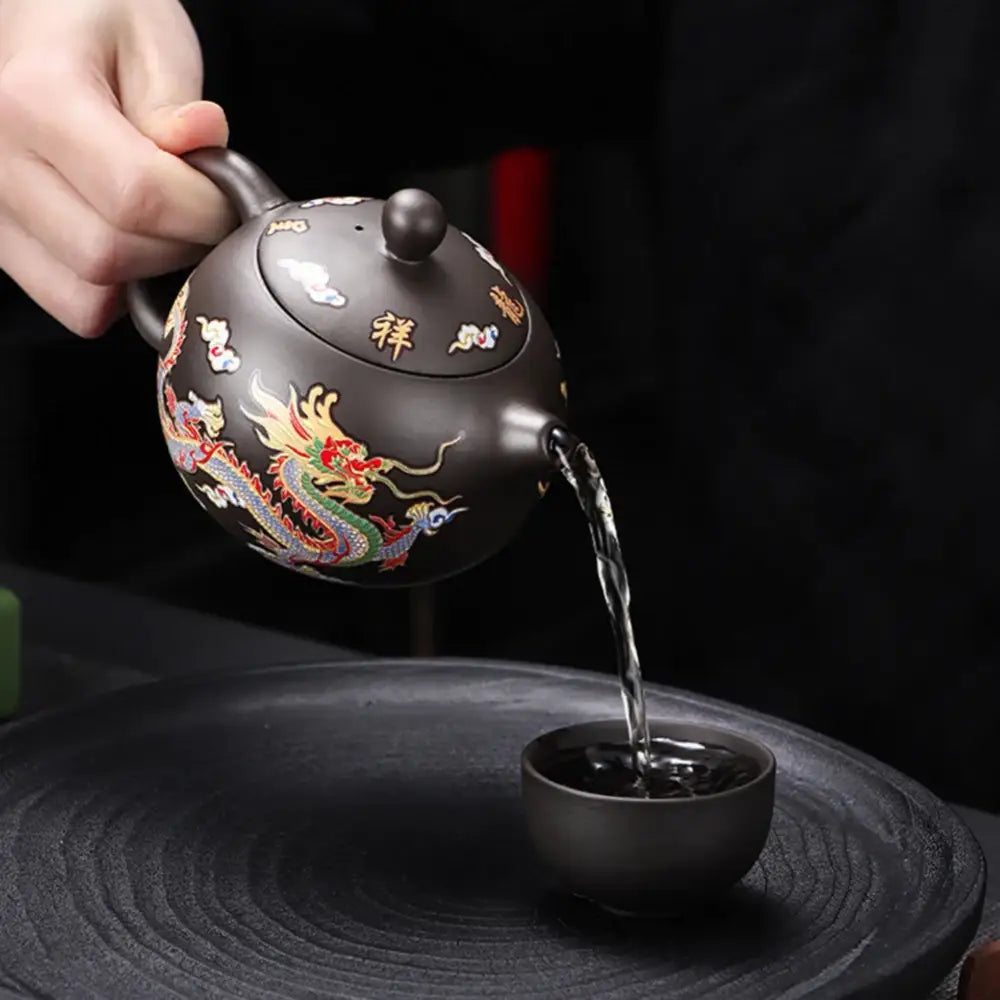 Asian teapot with ergonomic handle and spout