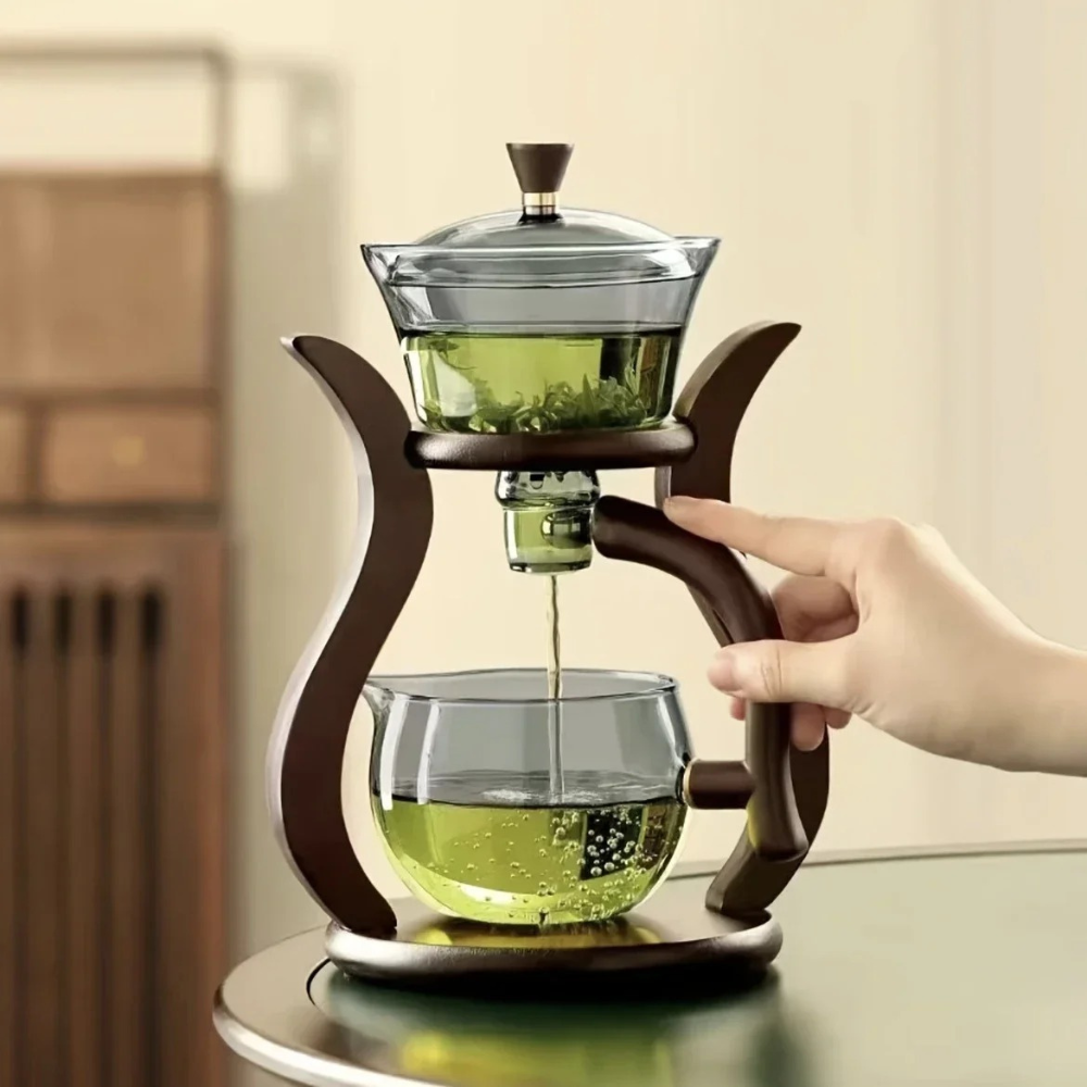 Loose leaf tea steeping inside glass teapot infuser, color visible