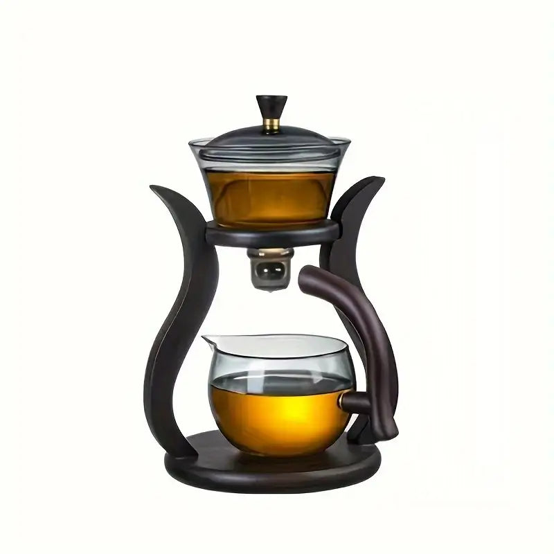 Tea being poured from borosilicate glass teapot with automatic infuser