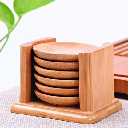 Natural bamboo coasters protecting table from hot cups