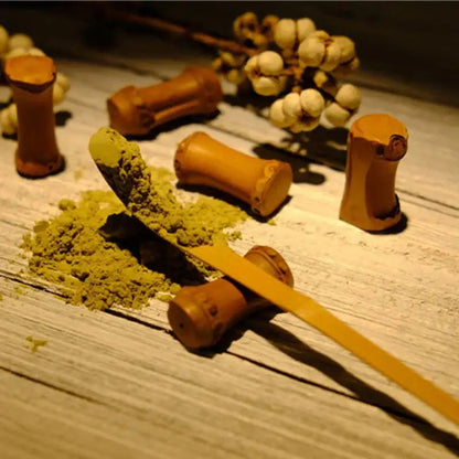 Bamboo matcha spoon held in hand