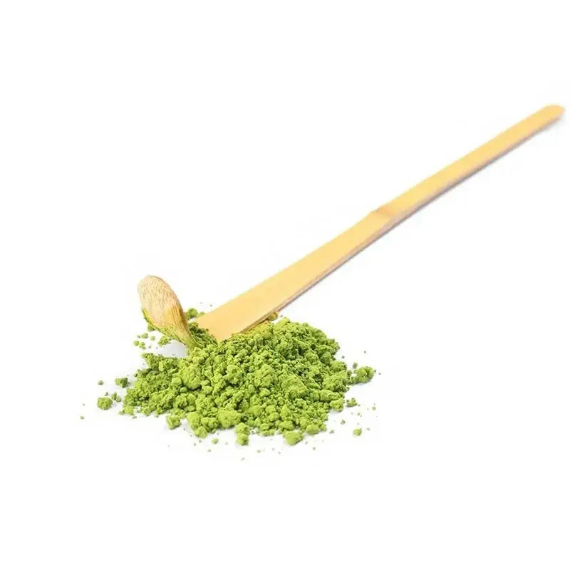 Bamboo matcha scoop with tea ceremony items