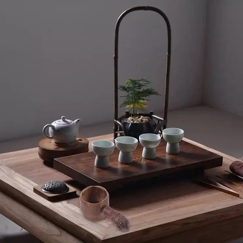 Bamboo tea infuser in a white mug with loose leaf tea
