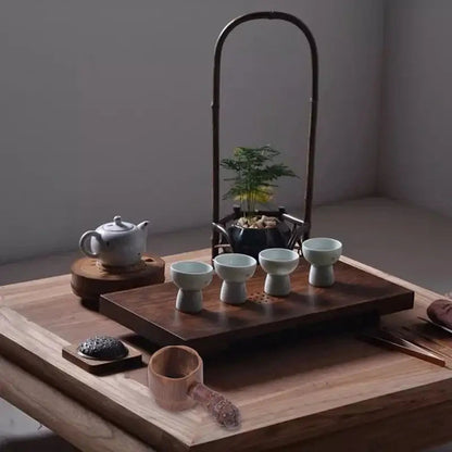 Bamboo tea infuser in a white mug with loose leaf tea