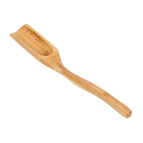 Eco-friendly bamboo tea scoop close-up showing grain texture