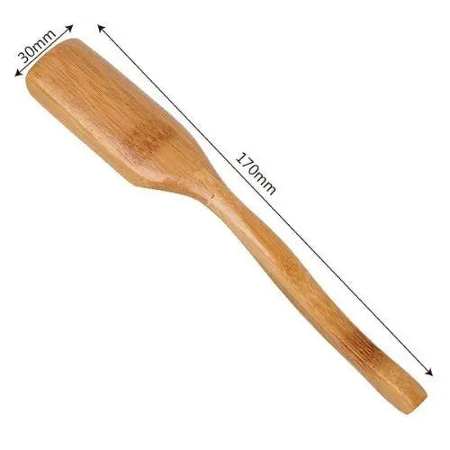 Bamboo tea spoon size reference next to tea caddy, 6.7 inches