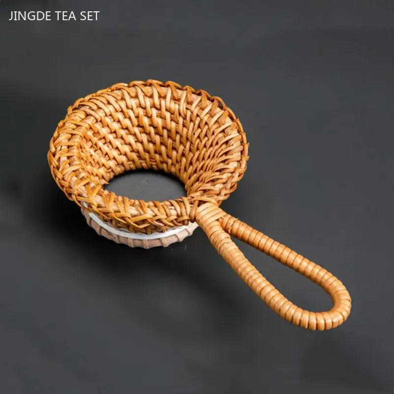 Bamboo tea strainer over a cup of tea