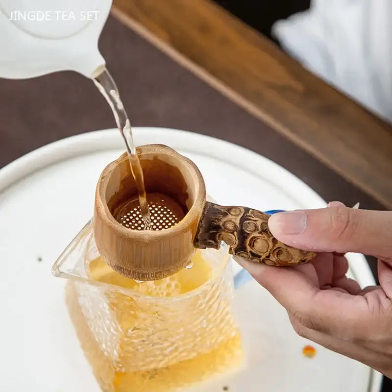 Bamboo tea strainer with tea leaves