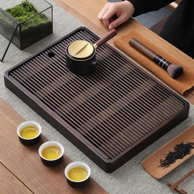 Bamboo tea tray with slatted top and hidden reservoir