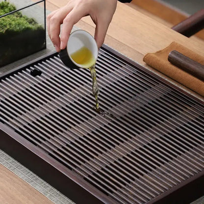 Bamboo tea tray with cups and teapot from above