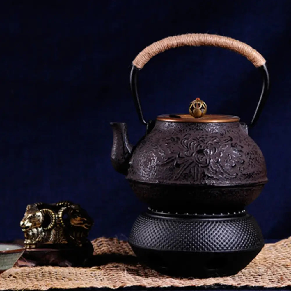 Black cast iron warmer with open lattice sides showing airflow design