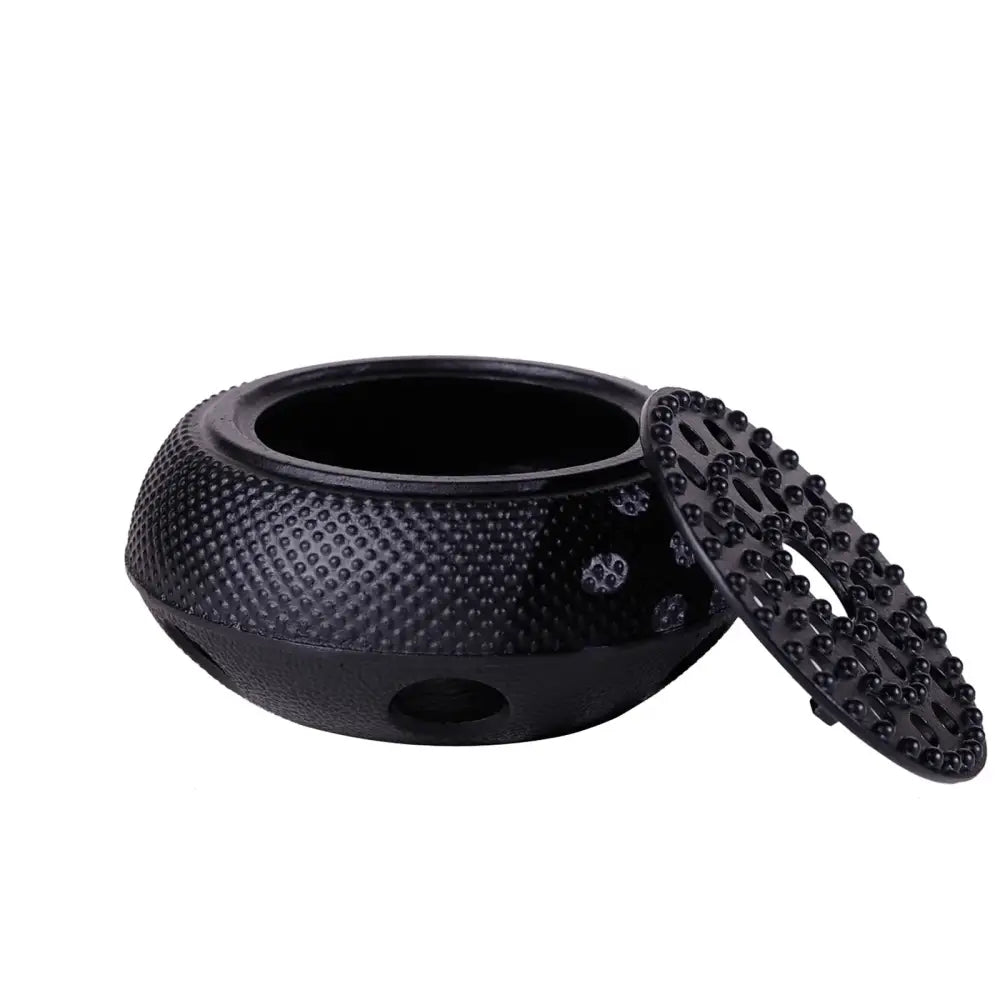 Black cast iron teapot warmer side view showing ventilated lattice structure
