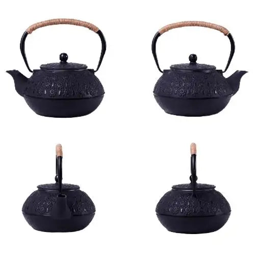 Close-up of black cast iron teapot flower engravings and enamel finish