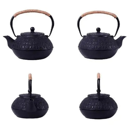 Close-up of black cast iron teapot flower engravings and enamel finish