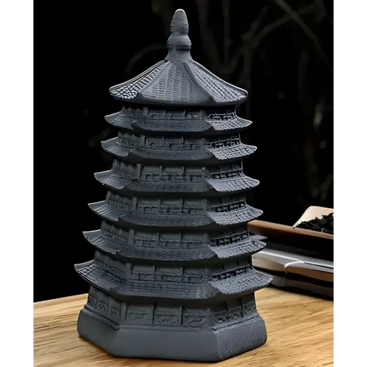Matte black ceramic tea storage jar with ornamental Temple of Asia motif, side view