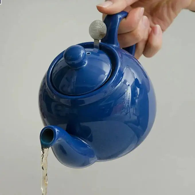 Close-up of blue ceramic teapot glaze