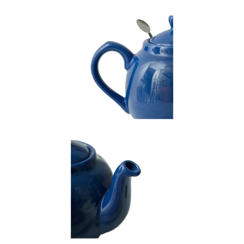 Blue ceramic teapot with cup and saucer