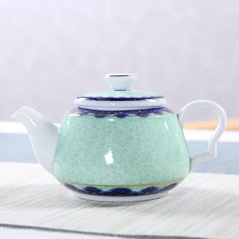 Blue sky ceramic teapot on a table