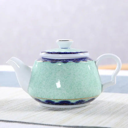 Blue sky ceramic teapot on a table