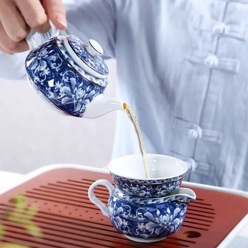 Blue ceramic teapot with steam rising