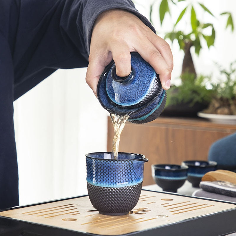 Detail of blue glaze on enameled Chinese teapot and gaiwan set