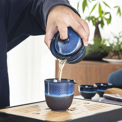 Detail of blue glaze on enameled Chinese teapot and gaiwan set