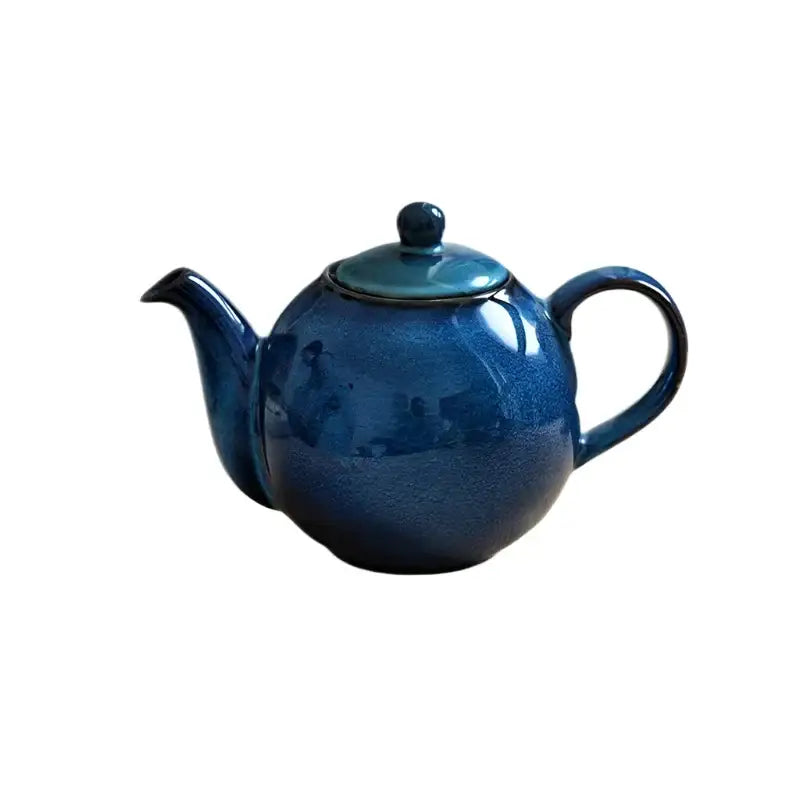 Blue night ceramic teapot side view showing handle