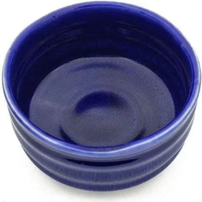 Blue ceramic chawan bowl on wooden table