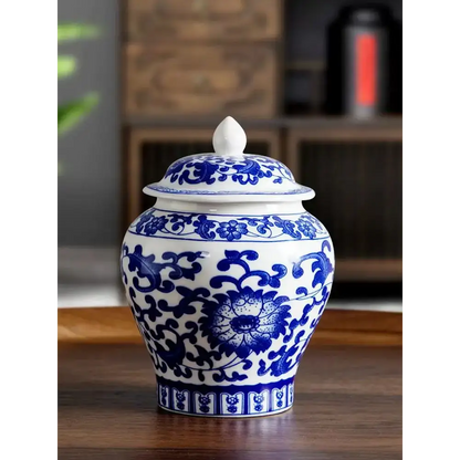 Blue porcelain tea canister flower design close up