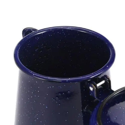 Blue ceramic whistling kettle with star motif on kitchen counter