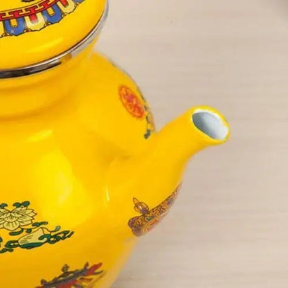 Buddhist tea kettle spout detail showing hand-enameled porcelain craftsmanship