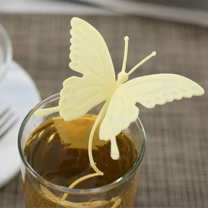 Yellow butterfly tea infuser on a saucer