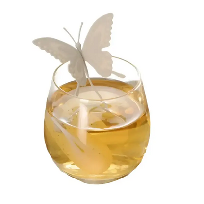 Gray butterfly tea infuser with steam rising from a cup