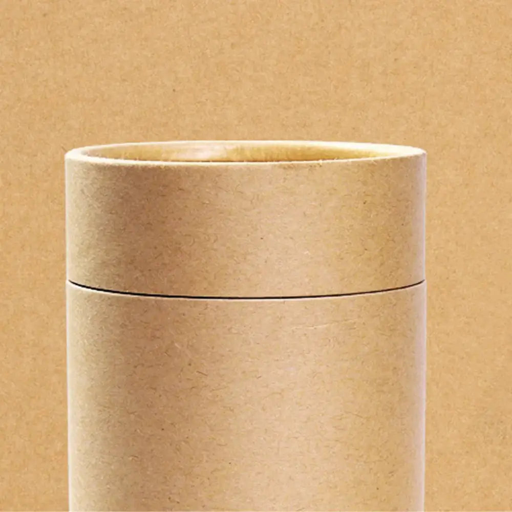 Cardboard tea organizer box on wooden countertop, lid closed