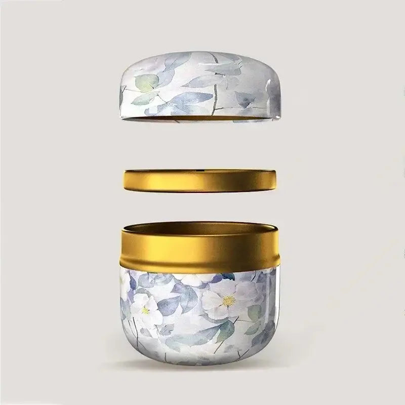 Cast iron tea caddy with floral relief design, double compartment tea canister