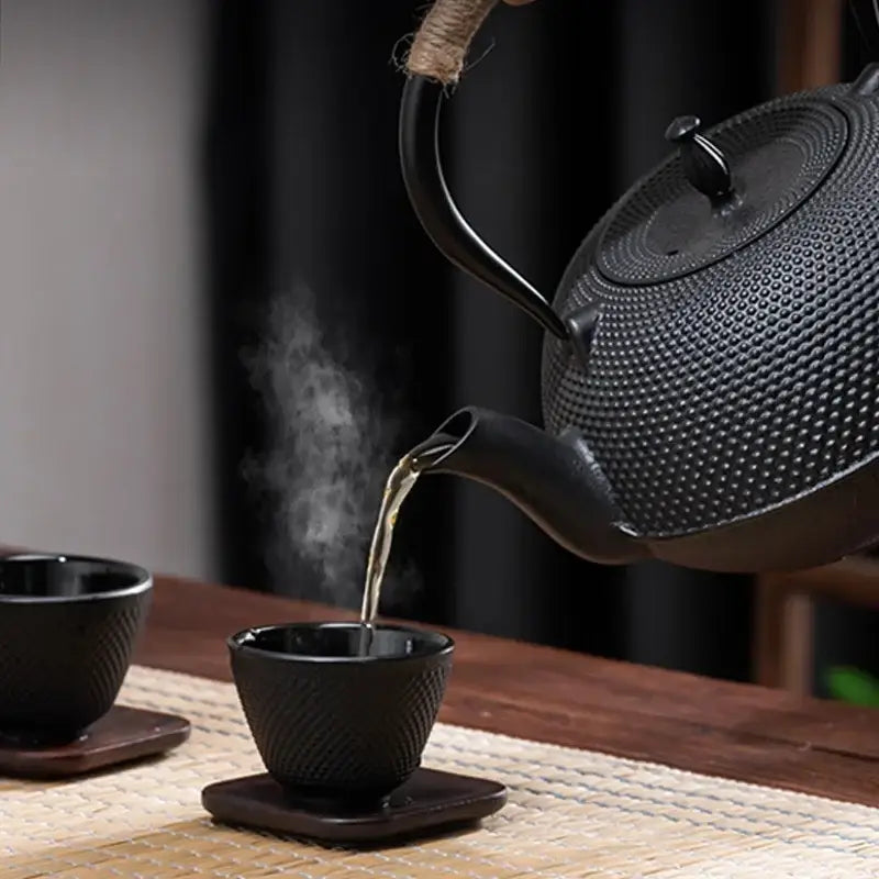 Close-up of cast iron teapot spout and lid knob, 900ml induction pot