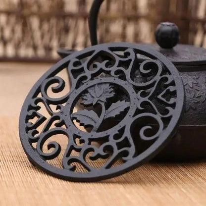 Cast iron teapot stand with Japanese flower pattern