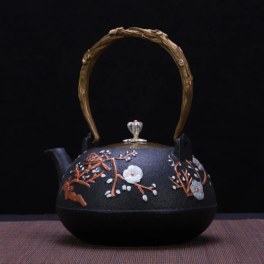 1200ml cast iron bird teapot, front view showing embossed motif on white background