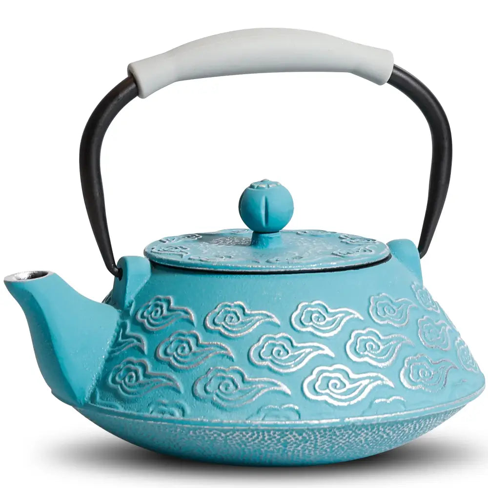 Blue cast iron teapot with matching cup and saucer