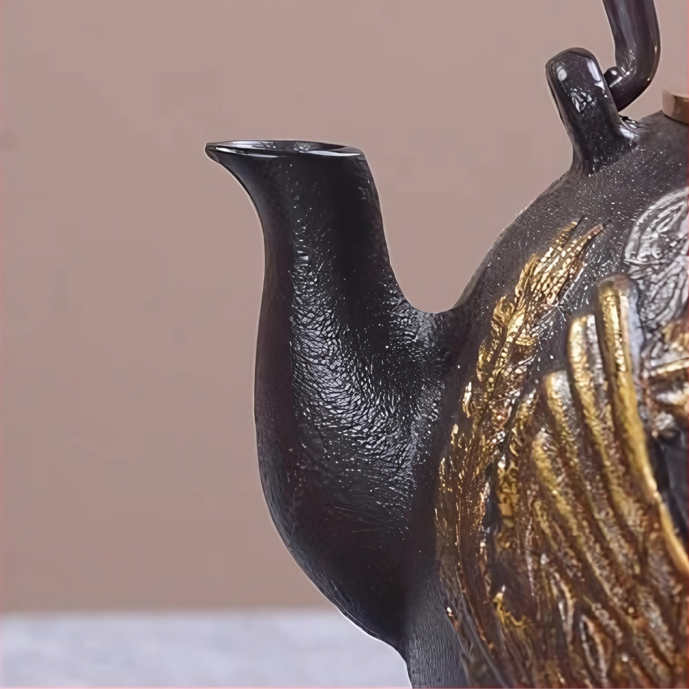 Cast iron teapot on wooden table with tea cups and dried leaves