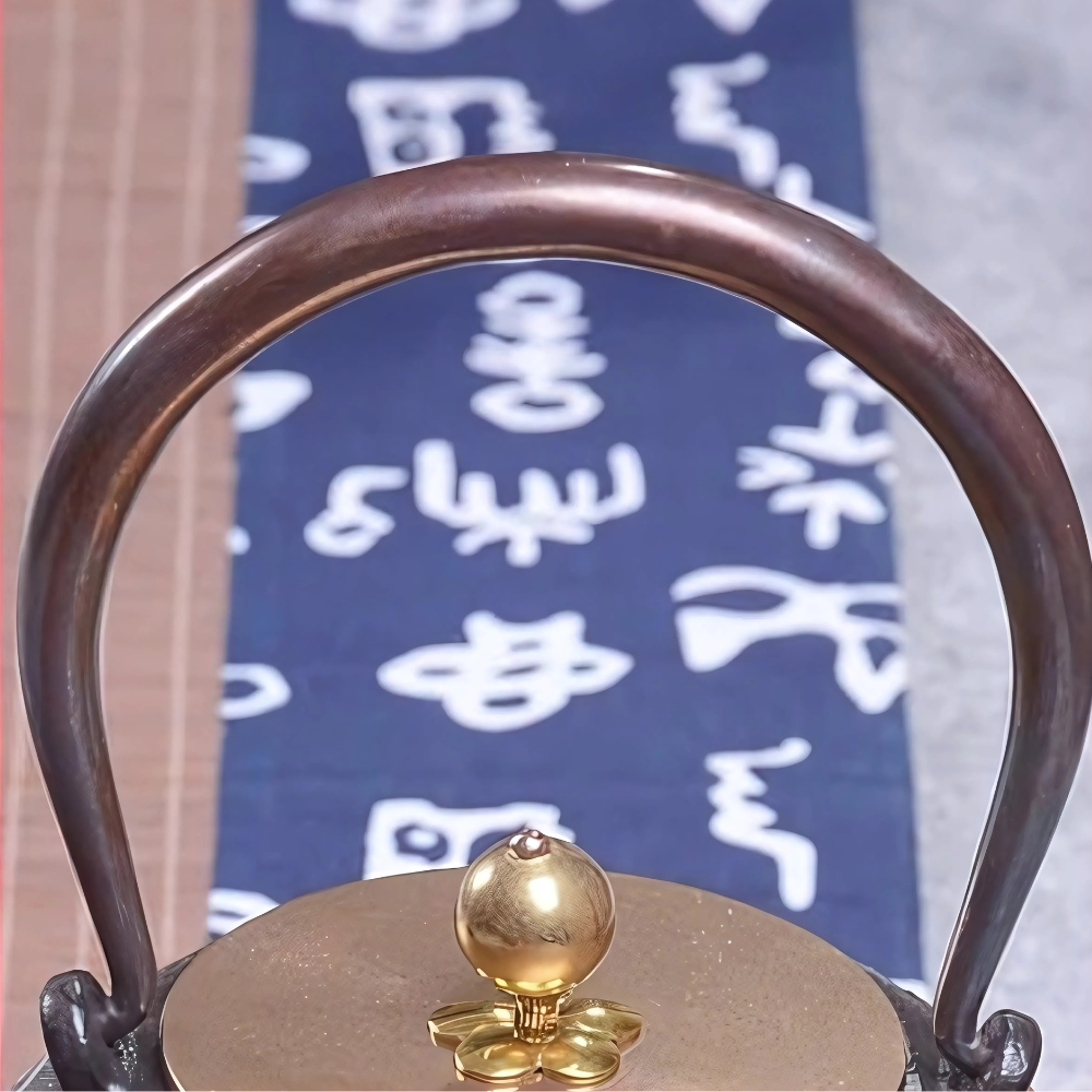 Detailed view of copper handle and cast iron body texture