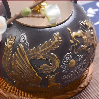 Cast iron teapot with phoenix and dragon design, front view